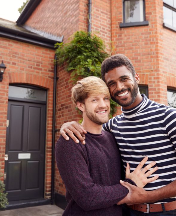 portrait-of-excited-gay-male-couple-standing-outsi-RUSPZE6-(FLIP)